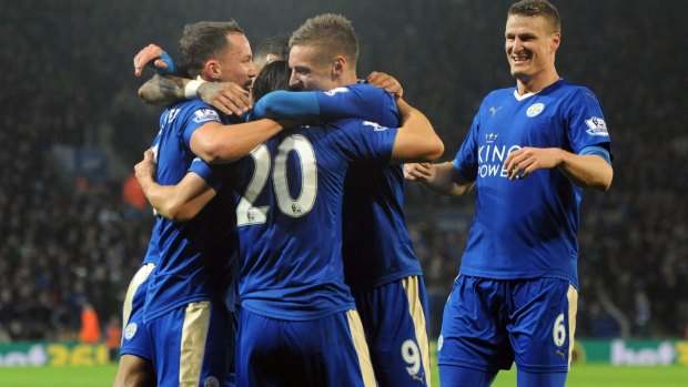 Fairytale: Leicester celebrate Okazaki's goal.