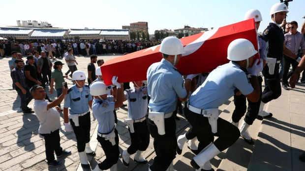 Colleagues carry the coffin of a police officer killed during a failed military coup last Friday, during his funeral at Kocatepe Mosque in Ankara, on Sunday.