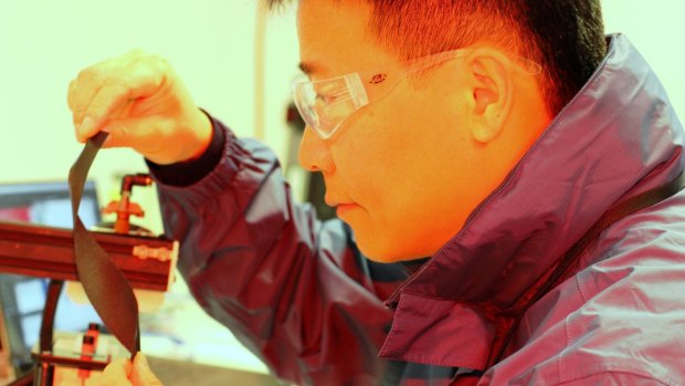 Early days: Professor Jun Chen with the new, flexible smart technology fabric.