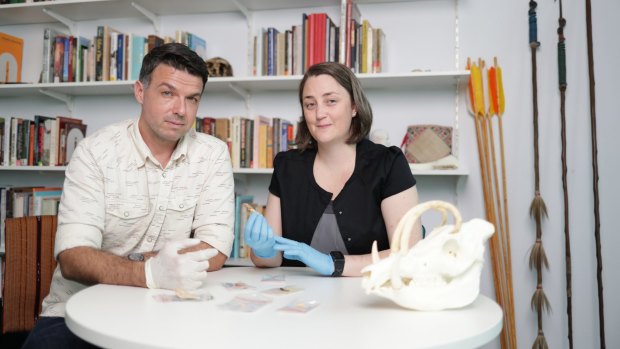 Griffith University archaeologists Associate Professor Adam Brumm and Dr Michelle Langley with some of the artefacts from the find.