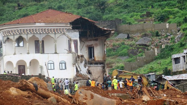 Volunteers search for bodies from the scene of heavy flooding and mudslides in Regent, just outside of Sierra Leone's capital Freetown last week.