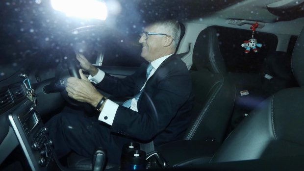 Malcolm Turnbull drives himself to Parliament House in Canberra on Wednesday morning.