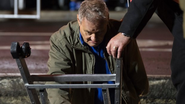 Artist Mike Parr emerges after 72 hours buried in a steel box underneath Hobart's Macquarie Street.