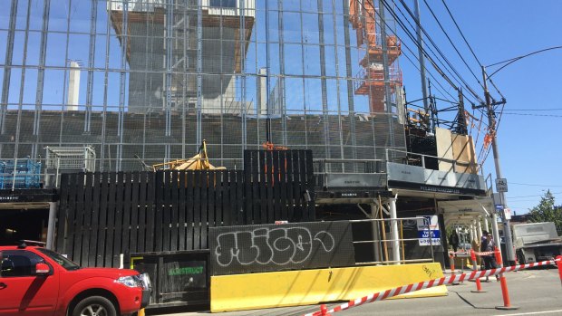 The man fell 20 metres from a  work platform at the site of a high rise apartment development in Carlton.
