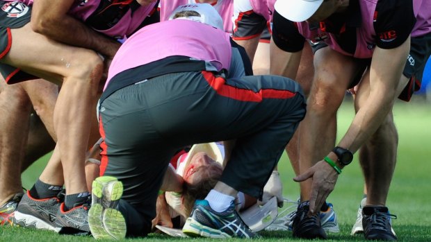 Nick Riewoldt is attended to by medical staff after he was injured during the game against the Adelaide Crows on Saturday. 