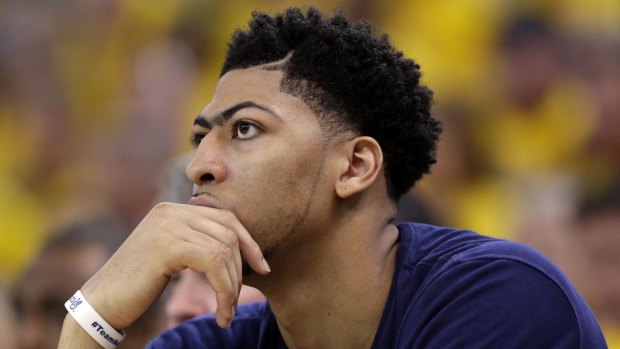Picture of concentration: New Orleans Pelicans forward Anthony Davis watches from the bench during the second half in Game 1 of the NBA basketball playoffs against the Golden State Warriors.