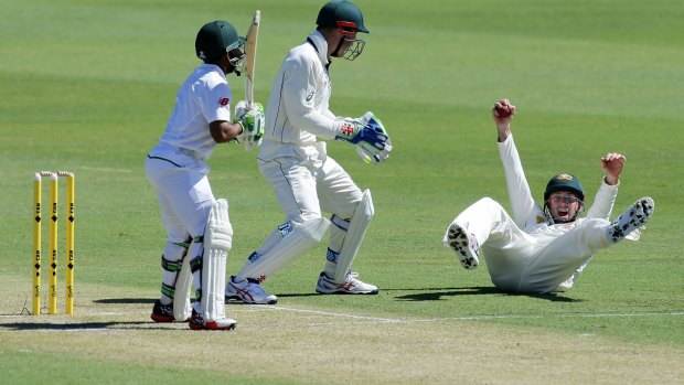 Shaun Marsh catches Temba Bavuma on day one of the first Test at the WACA.