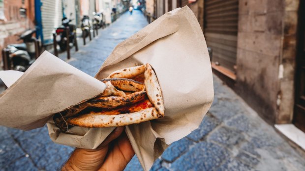 Pizza portafoglio, literally "wallet pizza", typically margarita flavoured and smaller than your classic sourdough one.\