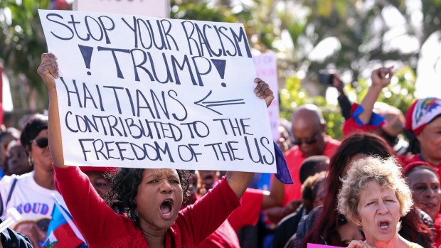 The large Haitian group said they were there to demand an apology from Trump. 