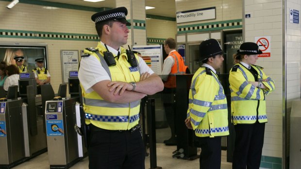 Police at Russell Square underground station, London, on the day it reopened after the July 7, 2005, attacks. 