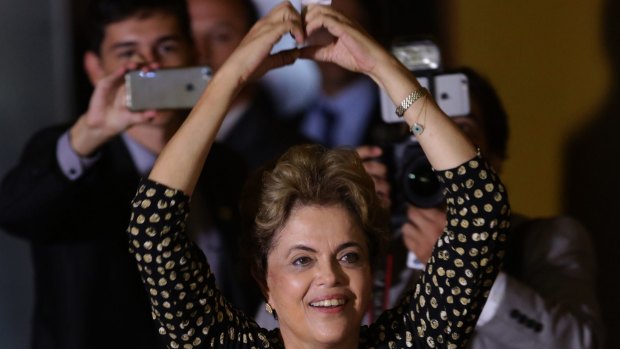 Brazilian President Dilma Rousseff makes a heart sign during the opening of the National Conference of Women  in Brasilia on Tuesday.