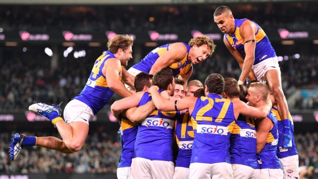 Eagles celebrate after a momentous after-the-siren win.