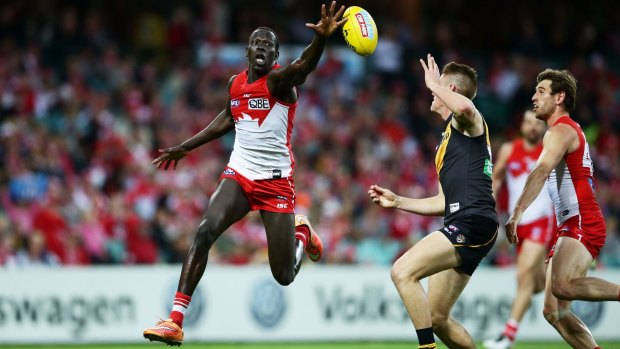Sydney Swan Aliir Aliir handles the ball against the Tigers in their round 23 clash at the SCG.