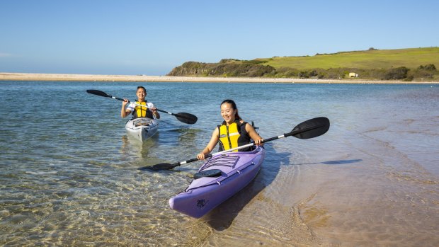 Kayak on the calm waters of the Minnamurra River, south of Kiama.