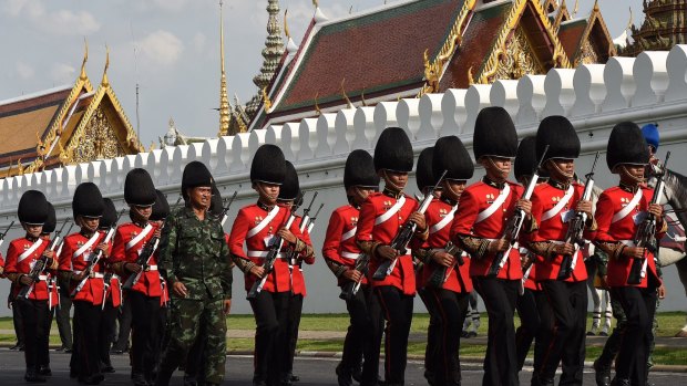 Guards outside the Grand Palace in Bangkok in preparation for the arrival of the body of Thailand's King Bhumibol Adulyadej.