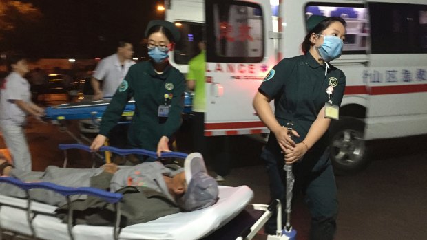 Paramedics transport a person injured in the explosion outside a kindergarten in eastern China's Jiangsu Province  on Thursday evening.