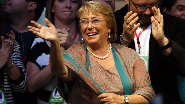 Chilean President Michelle Bachelet waves during a victory rally in Santiago in 2013. 