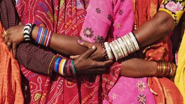 Embroidered saris and bangles, traditional dress for married women in Rajasthan.
