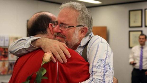 Christopher Brown and Tom Fennell hug after getting their marriage license in Omaha, Nebraska.