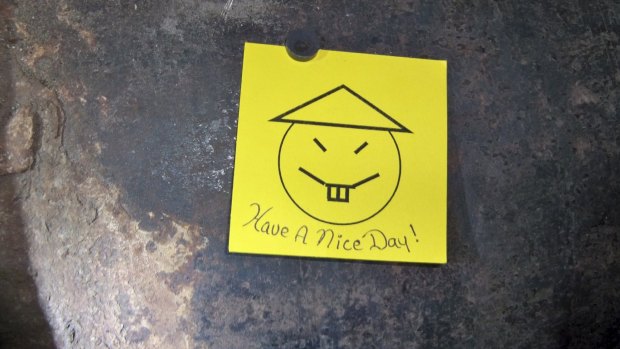 A note with a caption "Have a nice day" was left on an opening in the pipe two inmates are suspected to have cut open as part of their escape.