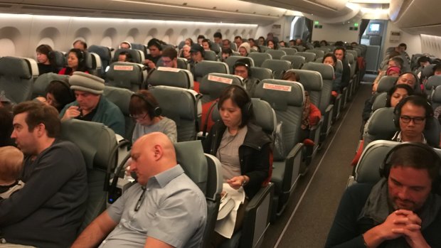 Halfway there. Passengers relax in the premium economy cabin.