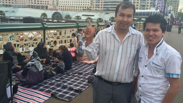 Abdullah Neshat and Mohammed Zini  on the Pyrmont Bridge with their families for the New Year's Eve celebrations. 