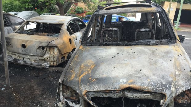 Two of the cars destroyed by fire at Bellevue Hill on Birriga Road.