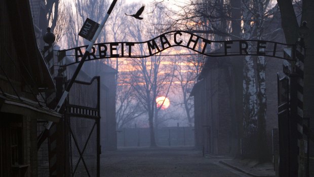 The main gate of the Nazi Auschwitz death camp at sunrise. 