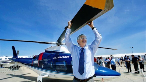 Traffic congestion is why Smith flies everywhere by helicopter. Here he is seen with  a $7 million Italian chopper he bought at the Melbourne International Air Show. 