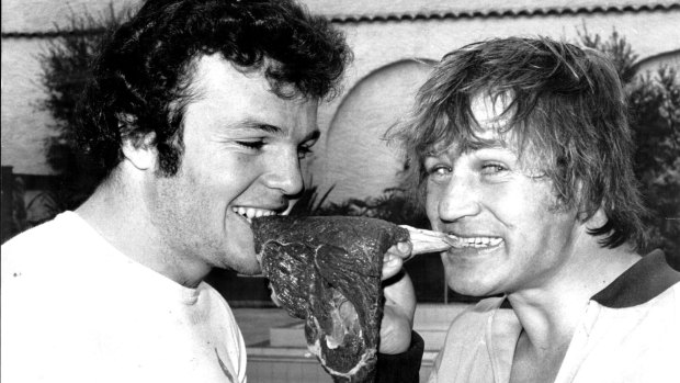 Les Boyd and Tommy Raudonikis rip into a steak in 1979.