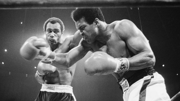 Muhammad Ali (right) winces as Ken Norton hits him with a left to the head during their re-match at the Forum in Inglewood, California, on September 10, 1973.
