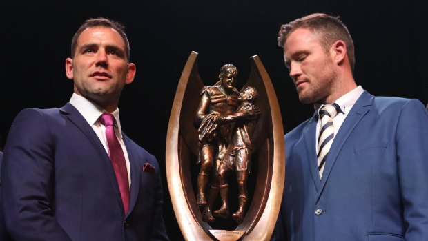 Eyes on the prize: Storm captain Cameron Smith and Cowboys captain Gavin Cooper with the NRL trophy.
