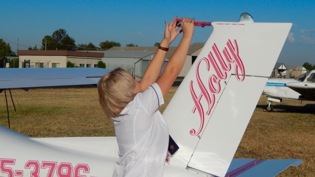 Holly, with customised pink Jabiru 2200 aircarft, hopes to be a commercial airline pilot one day.