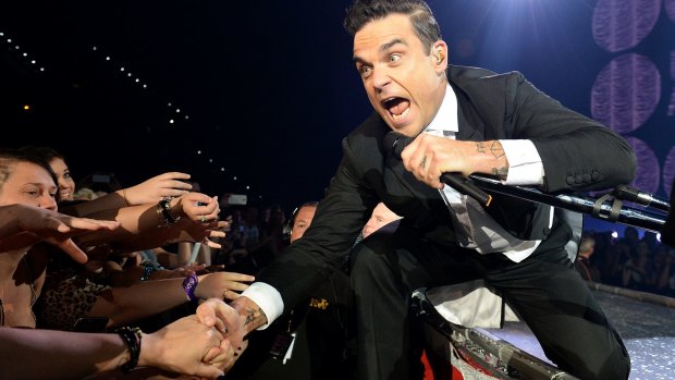 Robbie Williams performs in Brisbane during his 2014 tour.