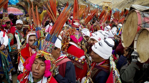 Pilgrims wait for the start of a procession to the Sanctuary of the Lord of the Qoyllur Riti, as part of the festival of the same name, translated from the Quechua language as "Snow Star".