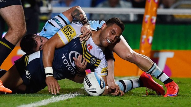 Winging it: Antonio Winterstein scores a try for the North Queensland Cowboys against the Cronulla Sharks at 1300SMILES Stadium.
