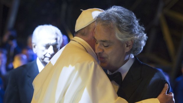 Pope Francis embraces Italian tenor Andrea Bocelli during a mass he celebrated at the World Meeting of Families, in Philadelphia. 