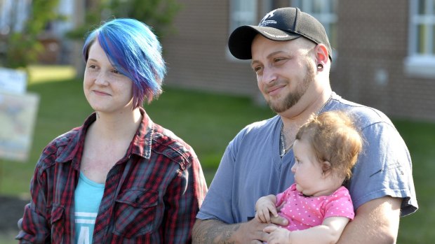 Lexie Colen, her husband Camryn Colen, and theirdaughter LaKoda at a same sex marriage rally on the lawn of the Rowan County Courthouse in Kentucky on Saturday. 