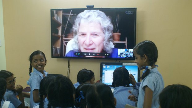 Schoolgirls at the Kalkaji government school in New Delhi talk to one of their "grannies". 