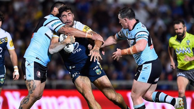Head first: Cowboys prop James Tamou chrages into Cronulla forwards Paul Gallen and Andrew Fifita.