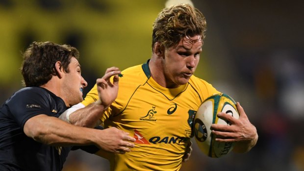 That winning feeling: Michael Hooper takes on Nicolas Sanchez of Argentina in Canberra in a match the Wallabies won well.