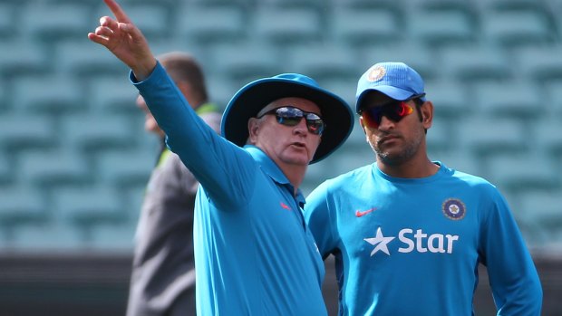 India's captain M.S. Dhoni talks to head coach Duncan Fletcher at the SCG on Monday.