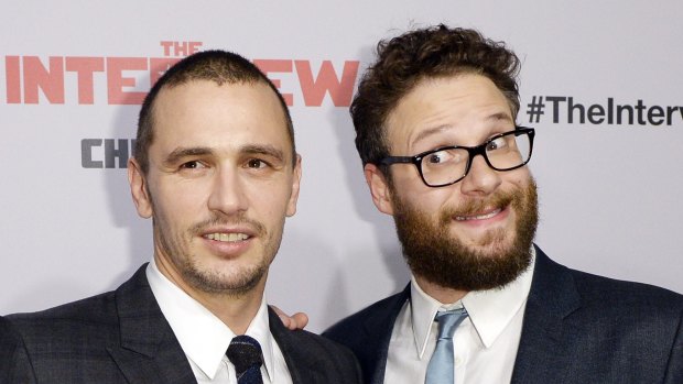 Cast members James Franco and Seth Rogen pose during premiere of the film The Interview.