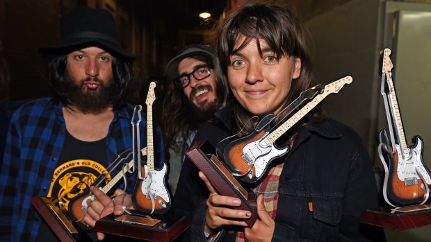 Courtney Barnett and band pose with their 4 awards.