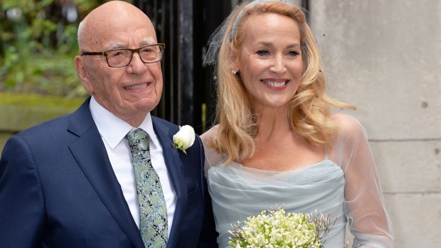 Media proprietor Rupert Murdoch and Jerry Hall pose outside St Bride's Church in London following their recent wedding.