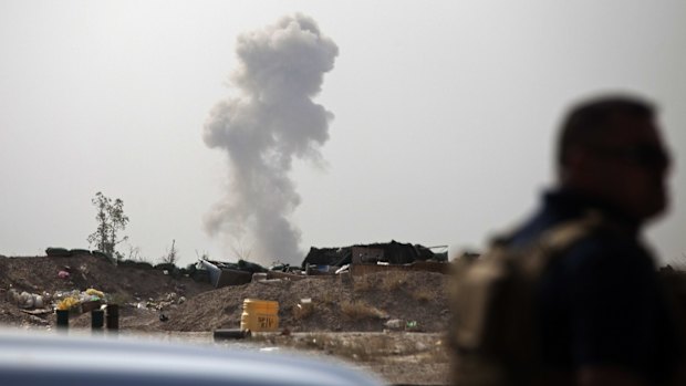 Smoke rises from an Islamic State car bomb on the front line in Fallujah.