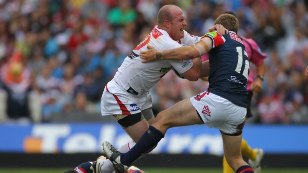 Career highlight: Dragons prop Michael Weyman rips in against the Roosters in the 2010 NRL grand final win. 