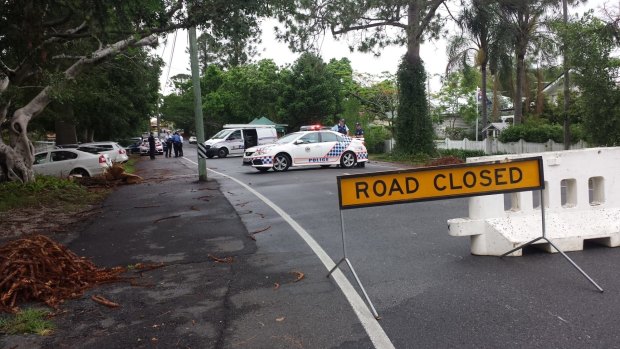 Police set up road blocks around the scene of a police shooting in Ashgrove.