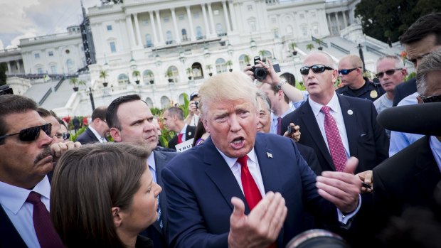 Donald Trump  talks to the media during a Tea Party Patriots rally against the Iran nuclear deal on Capitol Hill in Washington on Wednesday.