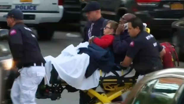 In this still image taken from video, emergency personnel respond to victims after a motorist drove onto a busy bicycle path near the World Trade Center memorial and struck several people.